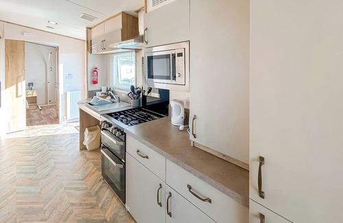 Bleadon House | Modern and contemporary 12ft-wide caravan with two twin.