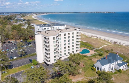 Scarborough Condo | Modern beachfront condo with balconies overlooking beach and ocean in O.O.B.
