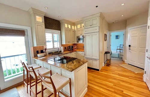 Commercial Street Condo | Modern beachfront condo with private deck, harbor views, and parking!