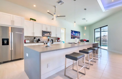 Pelican House | Modern Clean & Fully-Stocked Luxury Pool Home on Canal