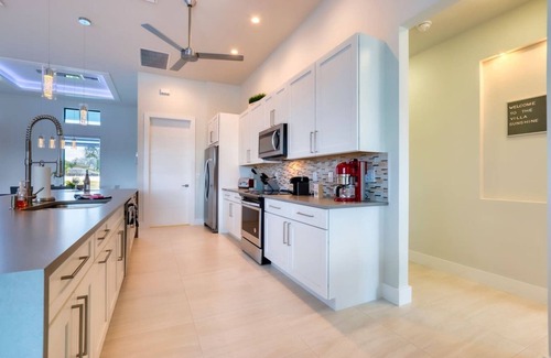 Pelican House | Modern Clean & Fully-Stocked Luxury Pool Home on Canal