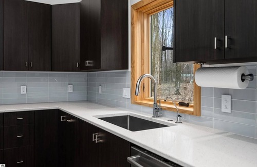 Interlochen House | Modern, custom home with 42-jet Jacuzzi in peaceful, private, wooded enclave