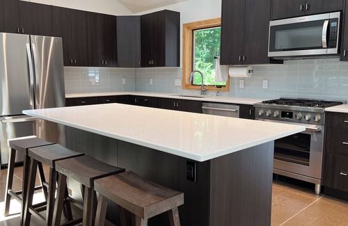 Interlochen House | Modern, custom home with 42-jet Jacuzzi in peaceful, private, wooded enclave