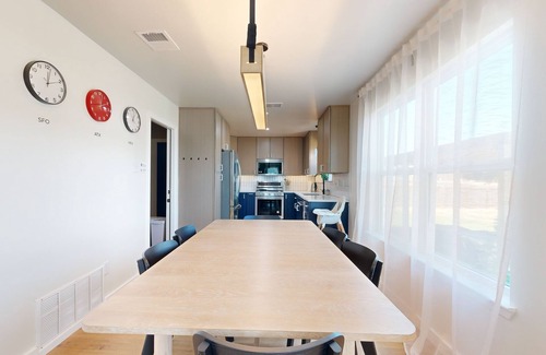 Scofield Farms House | Modern home with an enclosed backyard with wood fire pit in North Austin