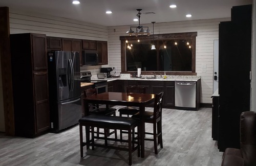 Tulsa Cabin | Modern Log Cabin with indoor and outdoor jacuzzi tubs