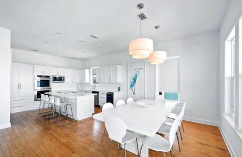 Pensacola Beach House | Modern retro design. Delightful kitchen. Covered Deck and Sound Front Pool