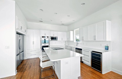 Pensacola Beach House | Modern retro design. Delightful kitchen. Covered Deck and Sound Front Pool