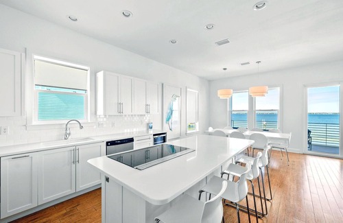 Pensacola Beach House | Modern retro design. Delightful kitchen. Covered Deck and Sound Front Pool