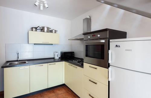 Smichov Apartment | Modern two-level apartment with balcony