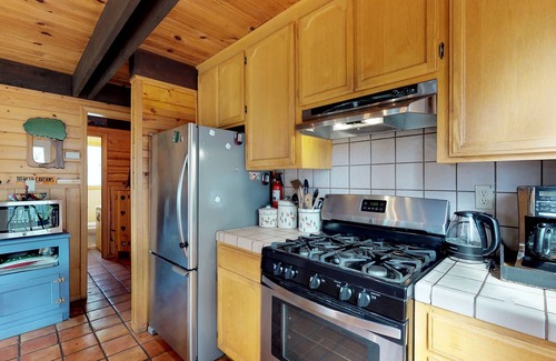Arnold Cabin | Mountain-view, dog-friendly A-frame cabin with pool & forest-view deck