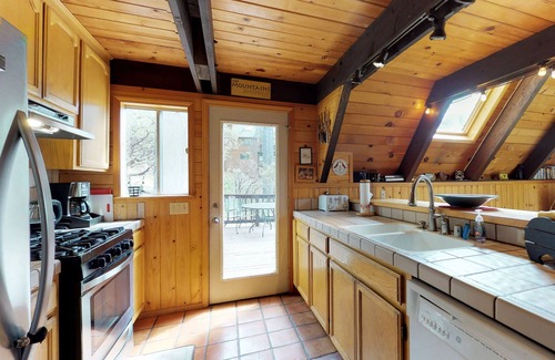 Arnold Cabin | Mountain-view, dog-friendly A-frame cabin with pool & forest-view deck