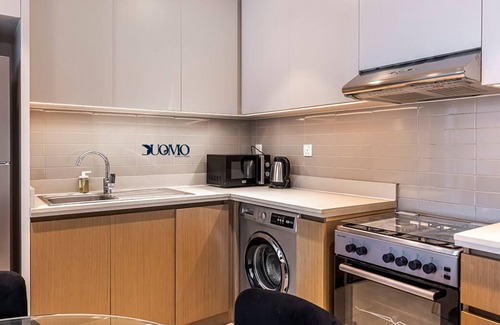Jadaf Apartment | MyDuomo: 1BR on high floor, with park & water views