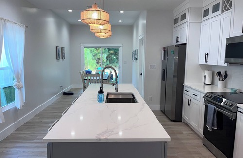 Foley House | Near Sports Complex, OWA, beaches, shopping, restaurants. King bed.