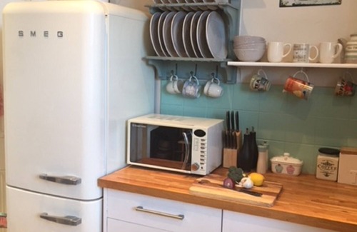 Swanage Apartment | Nestleton: Breakfast on the balcony or snuggle around the fire-dogs welcome too