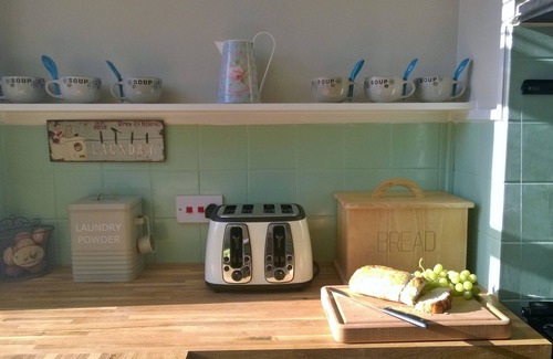 Swanage Apartment | Nestleton: Breakfast on the balcony or snuggle around the fire-dogs welcome too