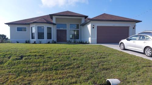 Burnt Store House | New 4 bed house on a canal facing south & door ramp, near golf course and softball