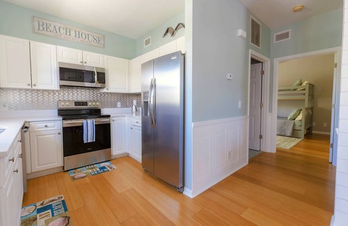 New Smyrna Beach Condo | *New Listing* Luxury Courtyard Condo! Walk to Beach/Restaurants/Shops. Free WiFi