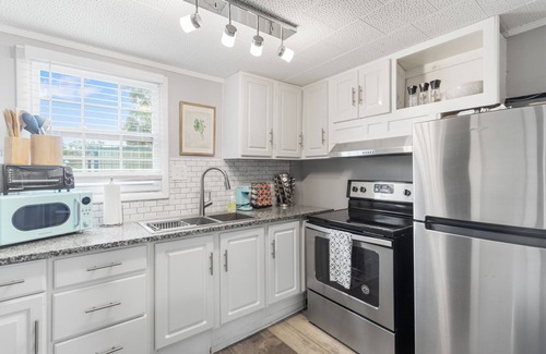 East Pensacola Heights House | NEW POOL NOW AVAILABLE FOR USE! Unit was meticulously furnished to give a coastal/farm house vibe