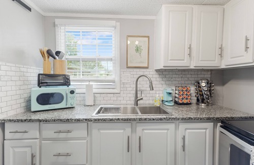 East Pensacola Heights House | NEW POOL NOW AVAILABLE FOR USE! Unit was meticulously furnished to give a coastal/farm house vibe