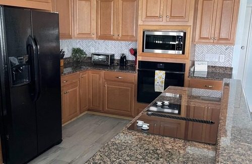 Pensacola Beach House | Newly Remodeled Waterfront 9 BR 5BA-100ft Dock-Elevator-Lg Hot Tub-Indoor Slide