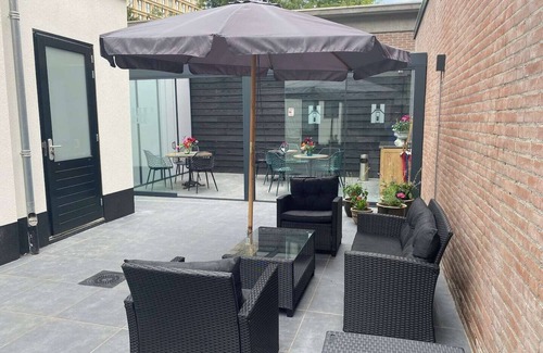 Centrum Apartment | Newly renovated 1920 building with large hotel bed, patio and shared kitchen.
