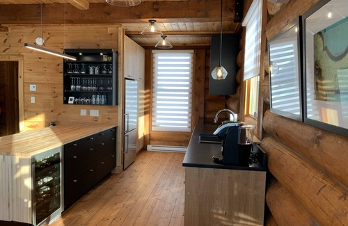 Lac Superieur Village Ski Chalet | Newly renovated log home with private spa and lake access.