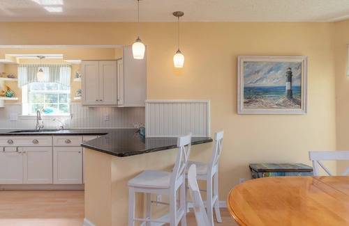 Tybee Island Cottage | North End! Tidal Creek, Dock to launch kayaks, Hot tub, TWO screened porches