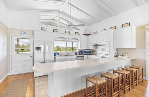 Pawleys Island House | Ocean and Creek Front Raised Beach House, 2 Porches, 2 Decks, Dock, Dog Friendly