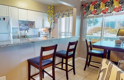 Satellite Beach Apartment | Ocean front apartment with pool, firepit, TV, & beach gear - snowbird friendly