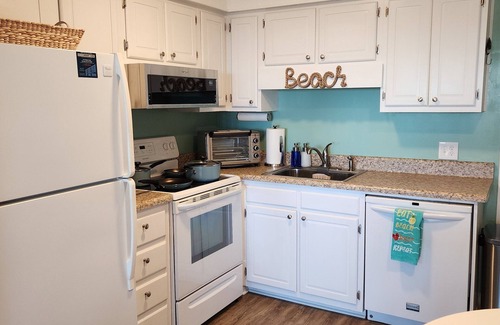 Morehead City Condo | Oceanfront complex, two pools, beach access, and king bed!