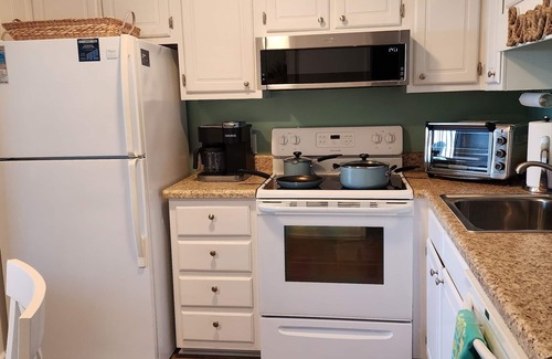 Morehead City Condo | Oceanfront complex, two pools, beach access, and king bed!