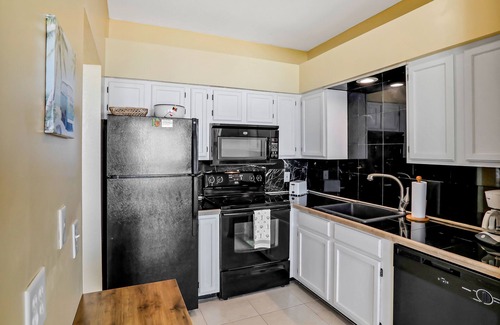 New Smyrna Beach Condo | Oceanfront condo with pool, balcony, ocean views, W/D, & central AC