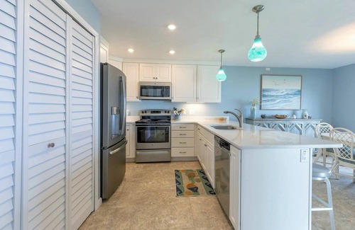 New Smyrna Beach Condo | Oceanfront Ground-Floor Retreat on No-Drive Beach | Peace & Comfort