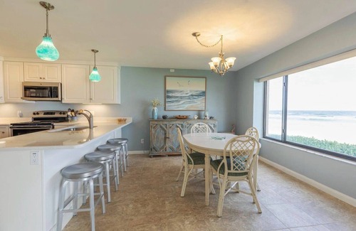 New Smyrna Beach Condo | Oceanfront Ground-Floor Retreat on No-Drive Beach | Peace & Comfort