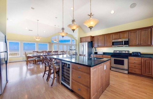 Ocean Isle Estates House | Oceanfront Home with Hot Tub, Pool, Putting Green, Elevator, and Game Room
