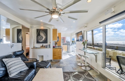 Central Mission Beach Condo | Oceanfront Surfrider windows to waves directly on the boardwalk with Hot Tub!