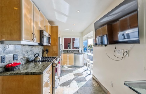 Central Mission Beach Condo | Oceanfront Surfrider windows to waves directly on the boardwalk with Hot Tub!