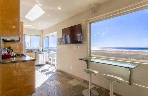 Central Mission Beach Condo | Oceanfront Surfrider windows to waves directly on the boardwalk with Hot Tub!