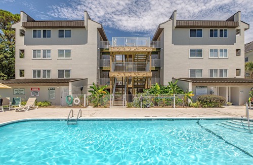 Saint Simons Island Condo | Oceanfront Condominium with Balcony, Pool and Boardwalk to Beach. Partial Ocean View