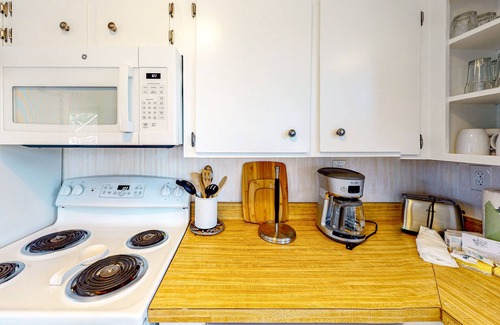 Avon House | Oceanside home with pool access, rooftop deck, screened porch - walk to beach