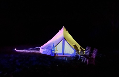 Bryson City RV Rental | Off grid Bell Tent Full size Bed & Solar powered.