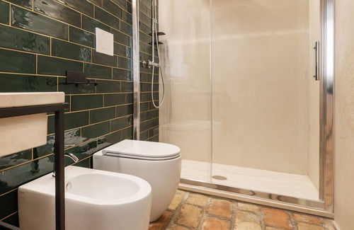 Fermo Bed & Breakfast | OGNISSANTI GUESTHOUSE,MARCHE REGION'S Double room with bathroom and a mezzanine with two single beds