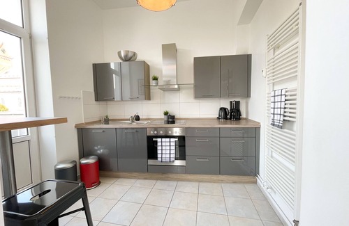 Schleswig Apartment | Old apartment with panoramic view of the Schlei, balcony and fireplace in the heart of Schleswig