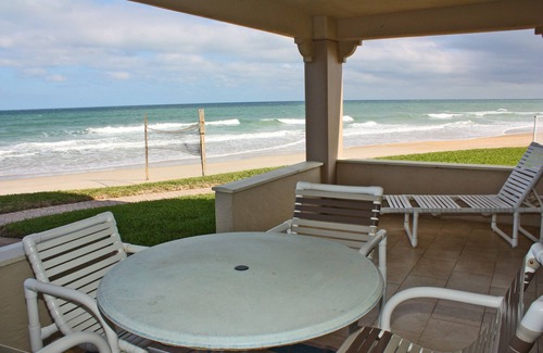 New Smyrna Beach Condo | One of a kind ground floor, three bedroom, three bath corner. Amazing south east ocean views.