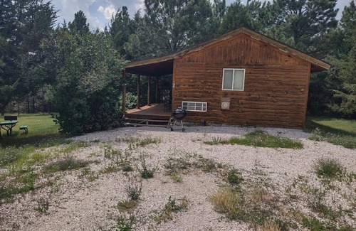 Rosebud Cabin | One of two rustic cabins nestled in Rosebud Sicangu Lakota Oyate pine forest.