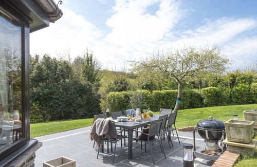 Wadebridge House | Overlooking the lakes of Roserrow, April Cottage is in an enviable location.