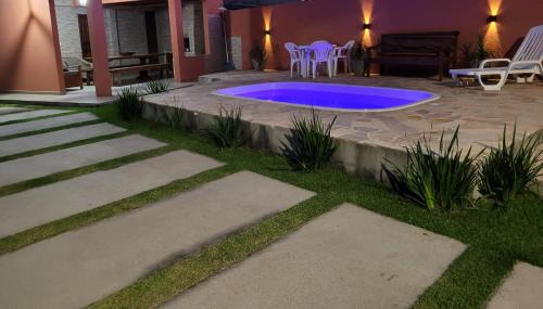 Guarda do Embau House | Partiu Praia SC piscinas privativas, ar condicionado, internet, próximo ao mar e centrinho três minutos a pé