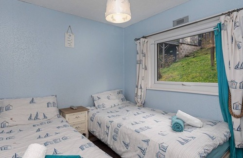 Bont Newydd House | Pass the Keys | Cosy Chalet at Lakeside Glan Gwna Holiday Park
