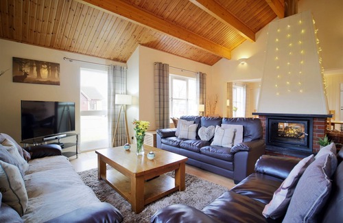 Aviemore Apartment | Pet friendly large four bedroom property with fire, sauna , enclosed garden with BBQ and views of th