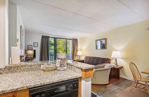 Killington Condo | Pinnacle E05 Close to skiing and riding, with shuttle to the slopes everyday of the week. The outdoor pool, hot tub, and, tennis courts are open during summer only.